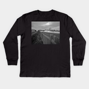 A view across the River Yare in the Norfolk village of Acle Kids Long Sleeve T-Shirt